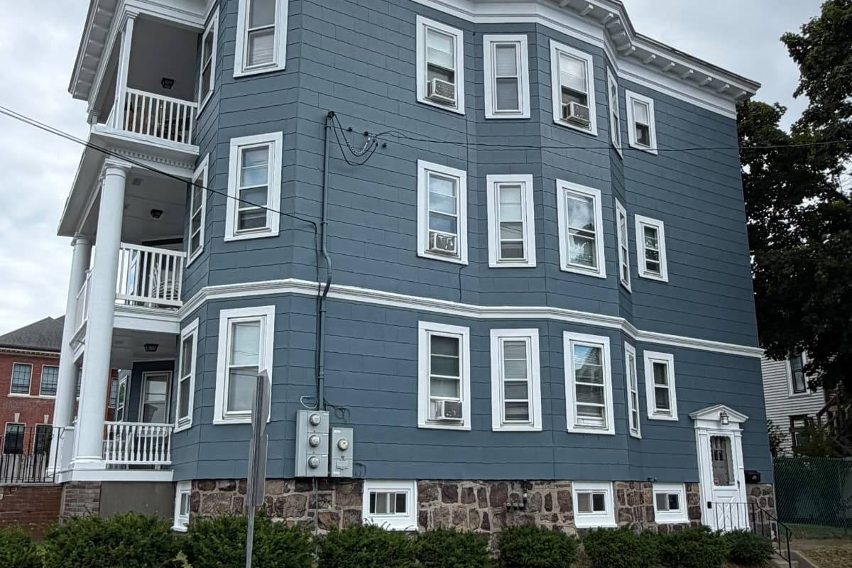 Exterior house painting by Reyes Services in Lynn, MA
