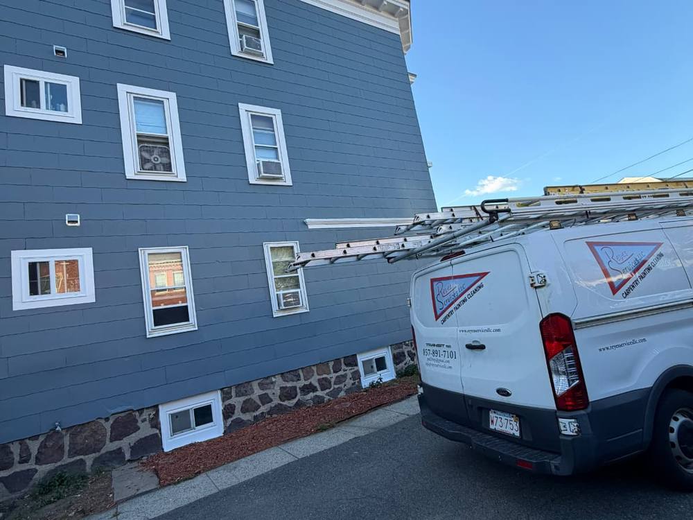 Reyes Services van at an exterior painting job